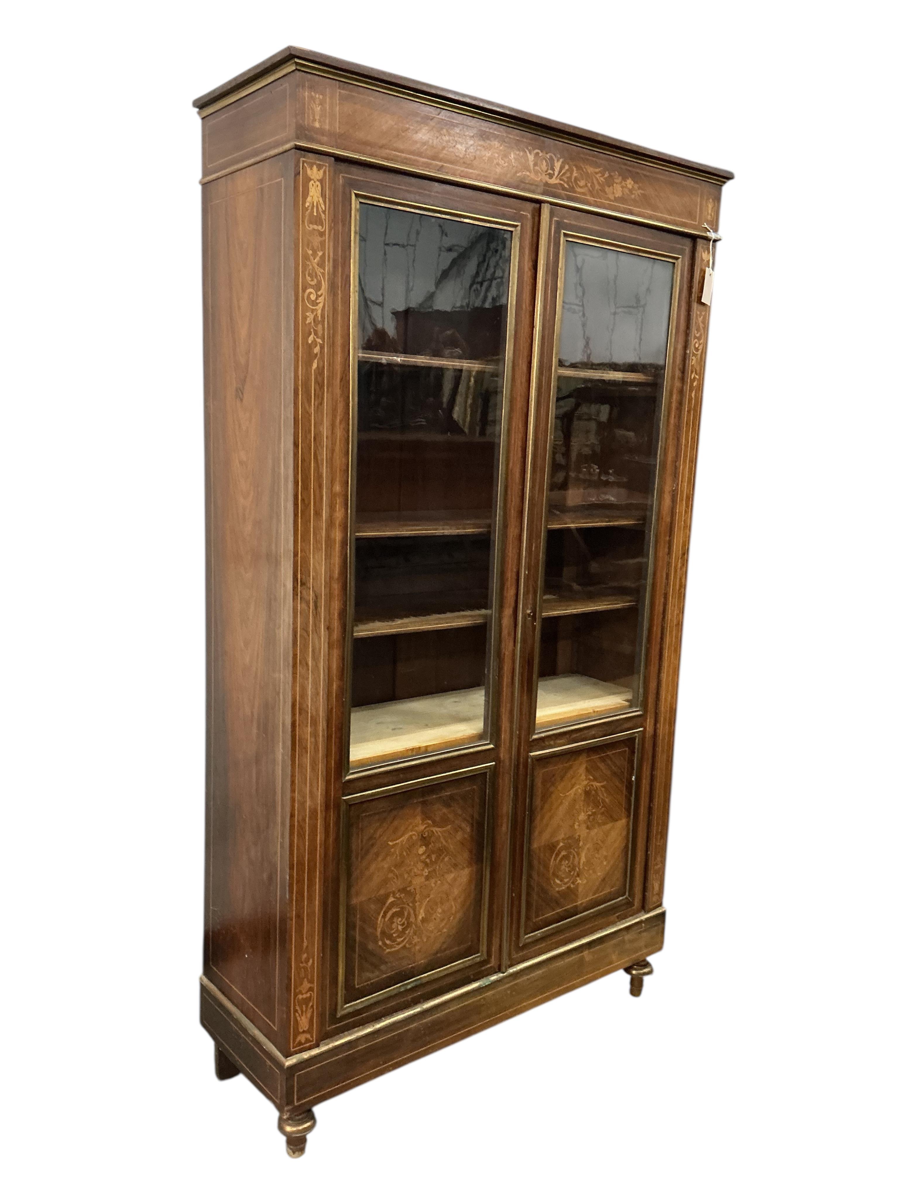 An early 20th century French brass mounted marquetry inlaid rosewood bookcase, width 104cm, depth 35cm, height 187cm